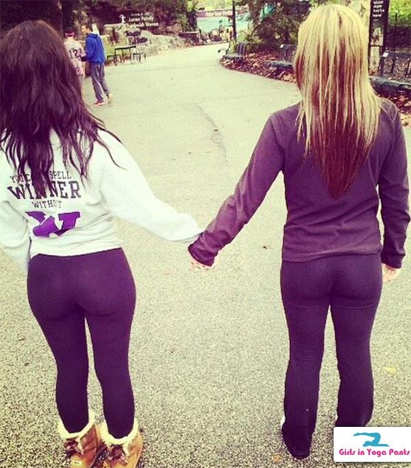 Two Girls Holding Hands In Yoga Pants Girls In